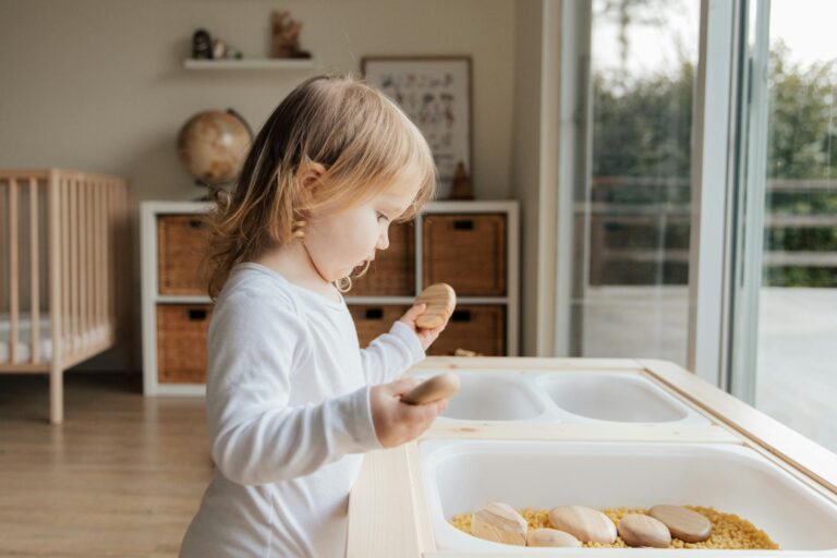 Young girl playing creatively indoors, enhancing development and imagination.